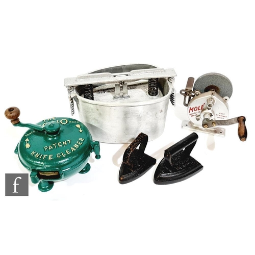 1850 - A Vono circular knife grinder, later green painted, a Mole hand crank operated grinder, two flat iro... 