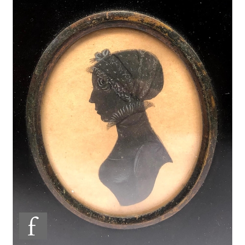 476 - An early 19th Century painted silhouette depicting Mr James Gibson in profile, oval, framed, 8cm x 5... 