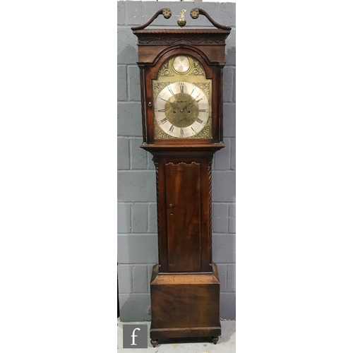 593 - A George III mahogany longcase clock with an eight-day movement striking on a bell, the hood with tw... 