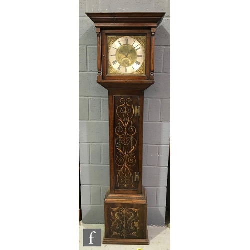 594 - A late 18th Century oak longcase clock with an associated 30-hour movement striking on a bell, the p... 