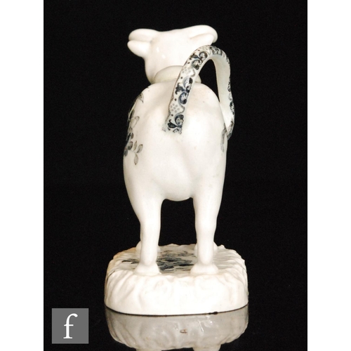 87 - A 19th Century Welsh pearlware cow creamer and cover, possibly Glamorgan, with black and white trans... 