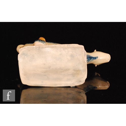 89 - An early 19th Century cow creamer and cover with milk maid and pail beneath, she decorated with blue... 