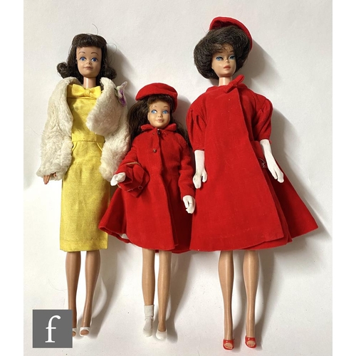 1157 - A collection of three 1960s Mattel Barbie dolls, comprising a brunette bubblecut (second version) Ba... 