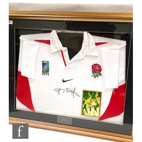 1694 - A framed 2003 England Rugby World Cup shirt signed by Jonny Wilkinson, with insert photograph, frame... 