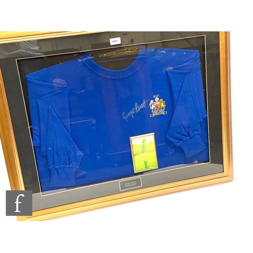 1697 - A framed blue shirt ECF Wembley 1968 signed by George Best, with insert photograph of the player sta... 