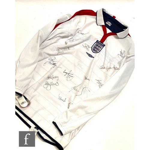 1705 - An England football shirt, 2004/2005 season, signed by various players in black ink to include Gary ... 