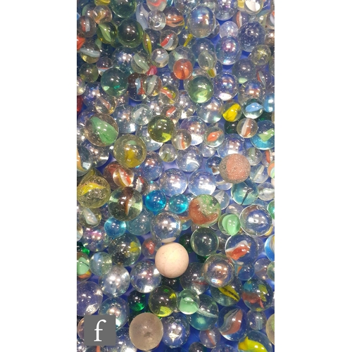 317 - A large collection of glass marbles, mostly swirl examples, most with pontil marks and bubbles, of v... 