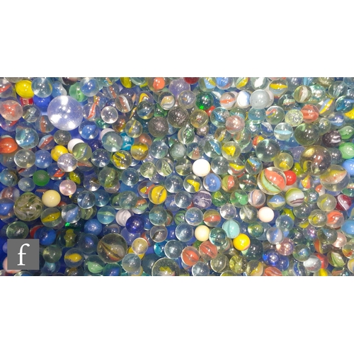 321 - A collection of glass marbles, of varying size and colour mostly swirl design, mostly with bubbles a... 