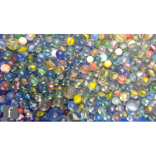 321 - A collection of glass marbles, of varying size and colour mostly swirl design, mostly with bubbles a... 