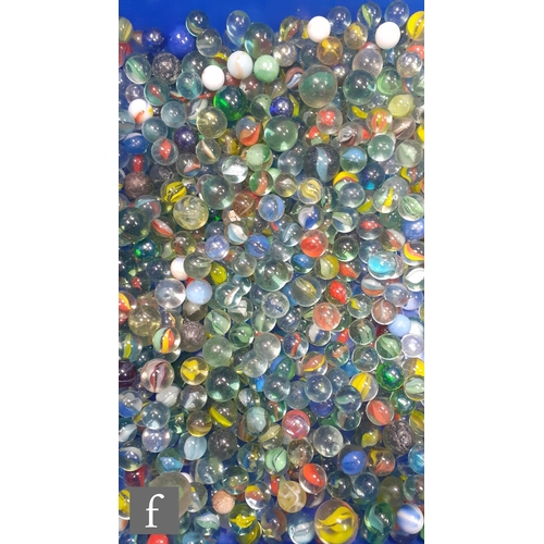 322 - A large collection of glass marbles, of varying size and colour but mainly swirl examples, many with... 