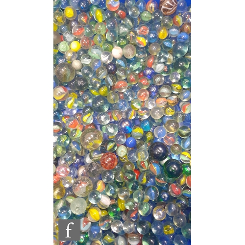 322 - A large collection of glass marbles, of varying size and colour but mainly swirl examples, many with... 