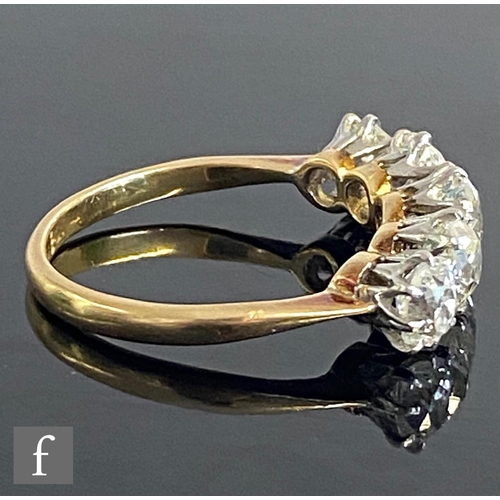 401 - An 18ct diamond five stone ring, graduated claw set old cut stones, total weight approximately 2.40c... 