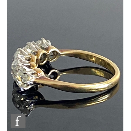 401 - An 18ct diamond five stone ring, graduated claw set old cut stones, total weight approximately 2.40c... 