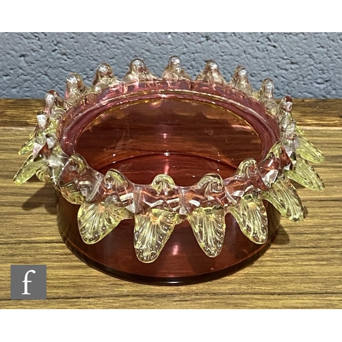 185 - A late 19th Century cranberry glass preserve bowl with clear crystal and citron applied trim, mounte... 