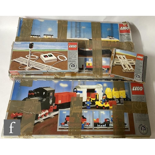 1128 - A collection of Lego railway items, 7740 InterCity Passenger Train, 7730 Electric Goods Train, 7857 ... 