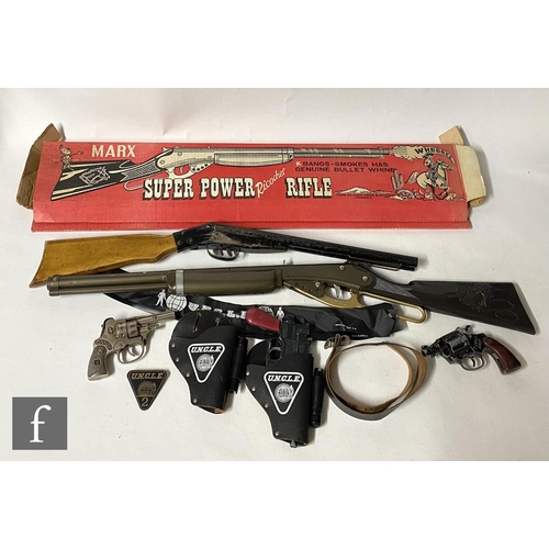 1145 - A Lone Star Man From UNCLE automatic pistol, together with holster and pin badge, with a boxed Marx ... 