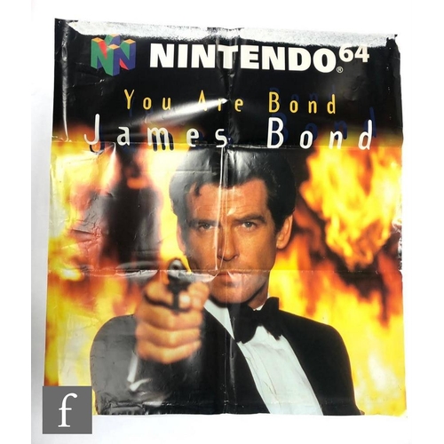 803 - Two James Bond related posters comprising a Goldeneye teaser one sheet poster and a James Bond Golde... 