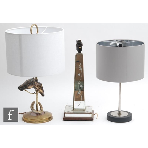 1853 - A collection of three various table lamps, to include an equestrian example, with twin light fitting... 