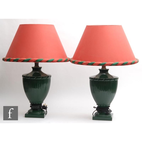 1858 - A collection of various table lamps, to include a pair of green glazed campana urn form examples, a ... 