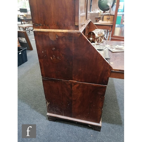 625 - An early 18th Century crossbanded and feather banded walnut bureau bookcase, the shelf and drawer in... 