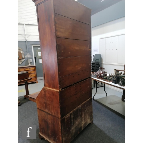 625 - An early 18th Century crossbanded and feather banded walnut bureau bookcase, the shelf and drawer in... 