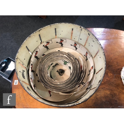 1143 - A late 19th to early 20th Century 'Wheel of Life' Zoetrope, the black lacquer exterior with painted ... 