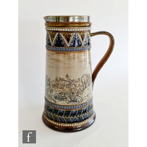 13 - A late 19th Century Doulton Lambeth jug decorated by Hannah Barlow with an incised band showing two ... 