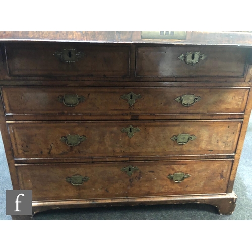 625 - An early 18th Century crossbanded and feather banded walnut bureau bookcase, the shelf and drawer in... 