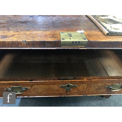 625 - An early 18th Century crossbanded and feather banded walnut bureau bookcase, the shelf and drawer in... 