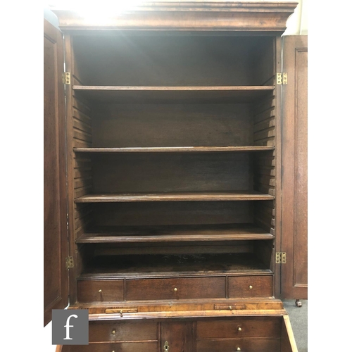 625 - An early 18th Century crossbanded and feather banded walnut bureau bookcase, the shelf and drawer in... 