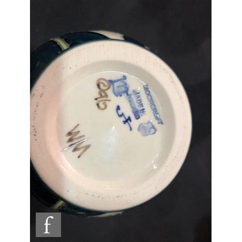 61 - A small Moorcroft Pottery vase decorated in the New Poppy pattern designed by Rachel Bishop, impress... 