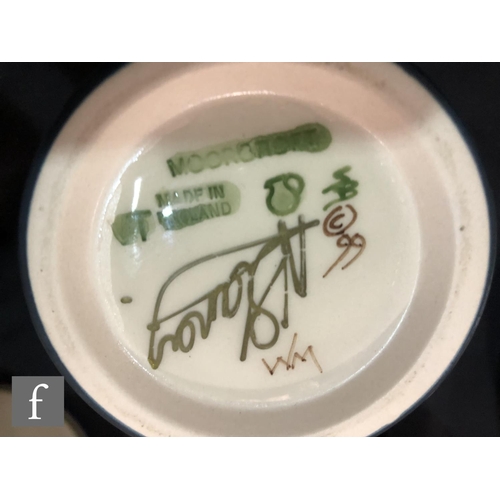 68 - A Moorcroft Pottery vase decorated in the Hellebore pattern designed by Nicola Slaney, impressed mar... 