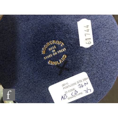 69 - A Moorcroft Pottery lamp base decorated in the Hepatica pattern designed by Emma Bossons, with Moorc... 