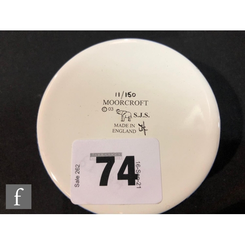 74 - A Moorcroft Enamels circular trinket box decorated with hand painted British birds (robin, kingfishe... 