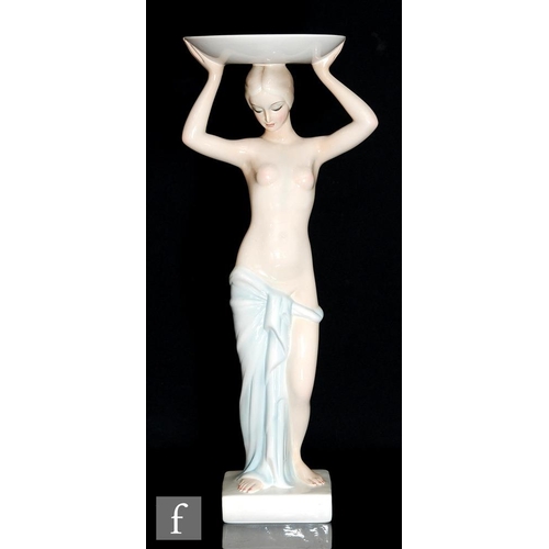 840 - Ronzan - A large pedestal bowl modelled as a standing female nude with a towel covering her modesty,... 