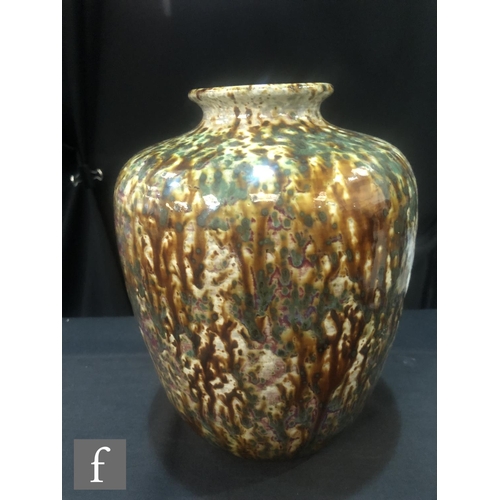 110 - Ruskin Pottery - A large high fired barrel vase with a squat flared collar neck decorated with brown... 