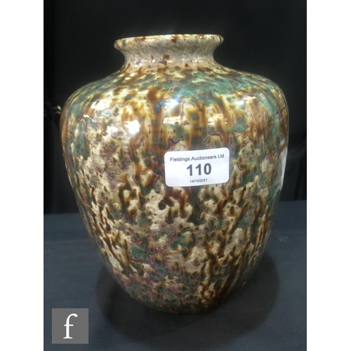 110 - Ruskin Pottery - A large high fired barrel vase with a squat flared collar neck decorated with brown... 