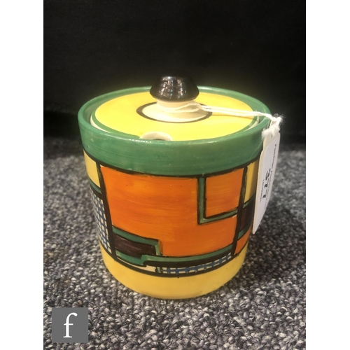 377 - Clarice Cliff - Football - A drum shaped preserve pot and cover circa 1930, hand painted with an abs... 