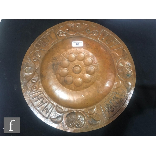 89 - Unknown - An Arts and Crafts copper wall plaque of circular form, with raised circle detailing to th... 