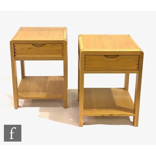 1501 - Ercol Furniture - A pair of light oak Bosco range side or lamp tables, each fitted with a single dra... 