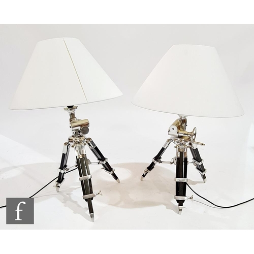 1510 - Eichholtz - A pair of 'Royal Marine' table lamps, the black and chrome splayed legs with moveable ha... 