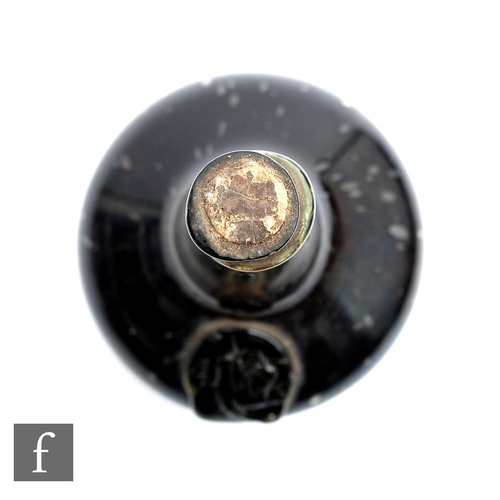 764 - A bottle of Hungarian Tokaji wine, circa 1650-1690, with seal showing crossed swords and indistinct ... 