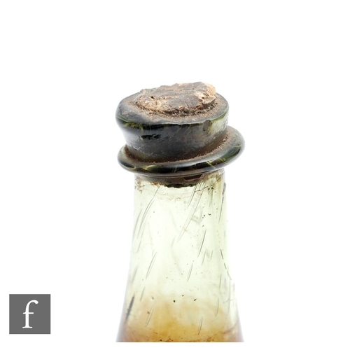 764 - A bottle of Hungarian Tokaji wine, circa 1650-1690, with seal showing crossed swords and indistinct ... 