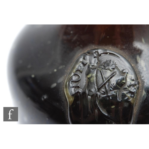 764 - A bottle of Hungarian Tokaji wine, circa 1650-1690, with seal showing crossed swords and indistinct ... 