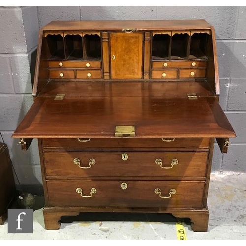 1151 - A George IV mahogany bureau with fall front and fitted interior above four graduated drawers and oge... 