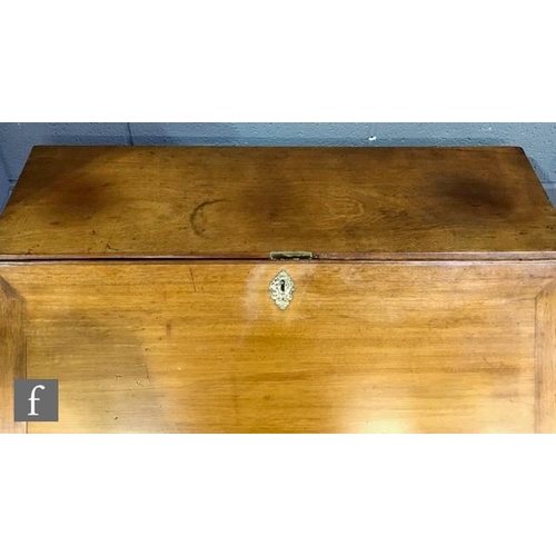 1151 - A George IV mahogany bureau with fall front and fitted interior above four graduated drawers and oge... 