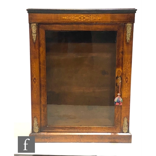 1157 - A Victorian walnut pier cabinet, the interior enclosed by a glazed door, with gilt metal mounts and ... 