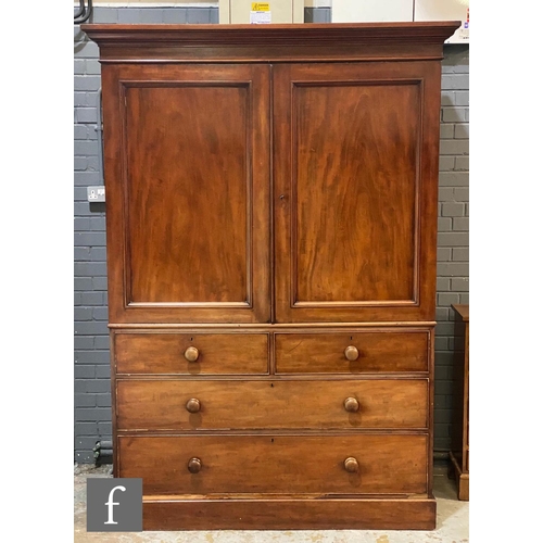 1163 - A 19th Century mahogany linen press cupboard, the cornice above double doors and an arrangement of t... 