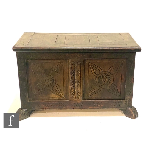 1149 - A small 18th Century style and later constructed oak coffer on stiles, twin carved panelled front, h... 