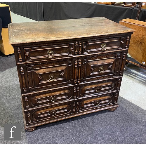 1139 - An 17th Century style oak geometric moulded oak chest of two short and three long drawers, applied m... 